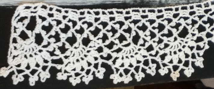 Closeup of wide lace edging.